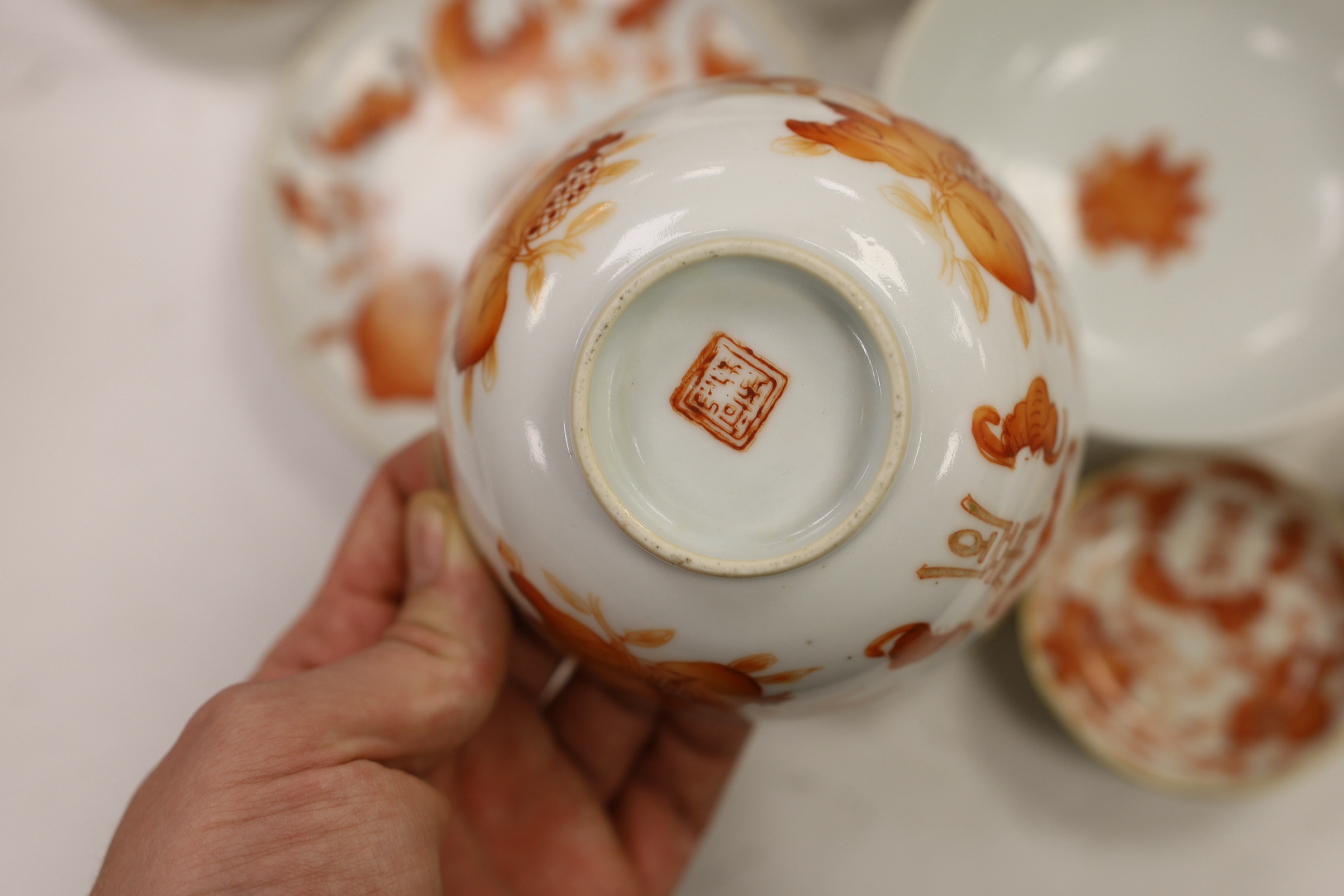 A group of Chinese iron red enamelled ‘sanduo’ bowls, saucers and side dishes, c.1900, Tongzhi and Guangxu marks